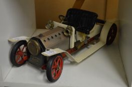 A Mamod steam car (missing fire box and other items).