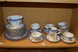 A floral decorated part tea service.