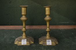 A pair of brass candlesticks.
