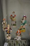 A small group of porcelain figures and figurines.