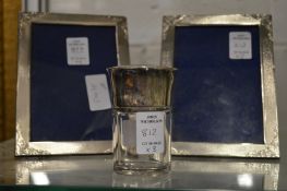 A pair of silver photograph frames and a silver and glass dressing table jar.
