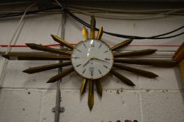 A Metamec Sunburst wall clock.