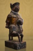 A small Chinese carved wood figure.