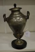 A pewter samovar.
