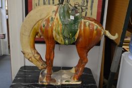 A large Tang style pottery horse.