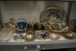 A shelf of plated items to include dishes, bowls etc.