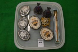 A pair of regimental place name holders and similar items.