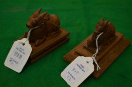 A small pair of carved sandalwood oxen.
