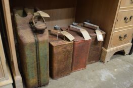 Three old petrol cans and a jerry can.