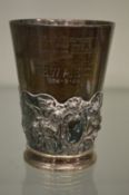 A Victorian silver beaker with ornate cast band, later engraved inscription.