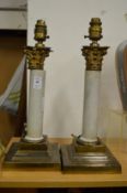 A pair of column style table lamps.