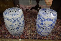 A pair of Chinese blue and white pottery barrel seats.