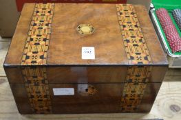 A Victorian sewing box containing various treen.