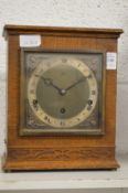 An Elliott oak cased mantle clock.