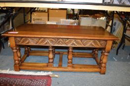 An oak coffee table and similar rectangular nest of tables.