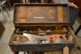 A carpenter's tool box containing various tools.