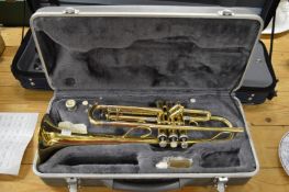 A Simba brass trumpet, cased.