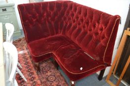 A crimson upholstered corner high back settee (for restoration).