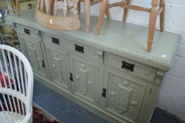 A green painted sideboard.