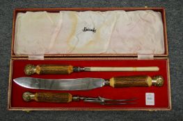 A Harrods' carving set, cased.