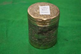 An eastern white metal cylindrical box and cover.