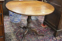 A George III oak tilt top tripod table.