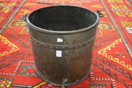 A copper coal bucket.