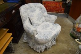 An upholstered bedroom chair.