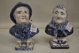 A pair of small pottery busts of a fisherman and a fisher wife.