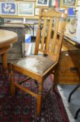 A set of four beech high back chairs.