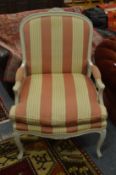 A French style painted and upholstered armchair.