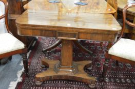 A 19th century rosewood D-shaped foldover card table on concave sided base.