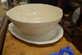 A large pottery bowl and a dish.