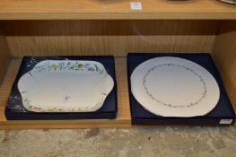 Two porcelain serving dishes, boxed.
