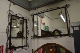 Two modern mirrors with black painted wrought iron frames.