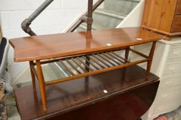 A teak two-tier coffee table.