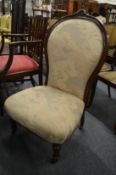 A Victorian mahogany framed and upholstered bedroom chair.