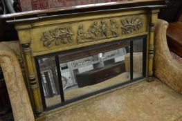 A Regency giltwood overmantle mirror with applied decoration.