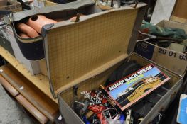 A Doll and Scalextric equipment.