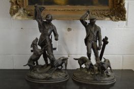 A good pair of spelter hunting figures, one with a huntsman with fox and hounds, the other with a