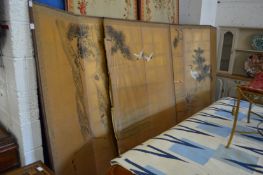 A pair of Japanese gilt paper and painted six panel folding screens decorated with herons and