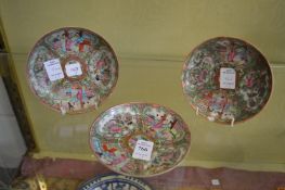 Three Canton saucers.