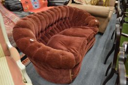 A button back, crimson upholstered two-seater settee.