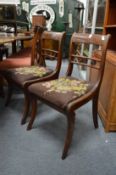 A pair of Regency mahogany dining chairs.