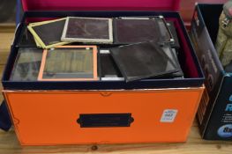 A box containing photographic slides, mostly topographical views etc.