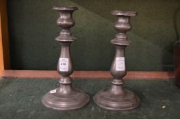 A pair of pewter candlesticks.