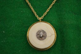 A decorative pendant and chain.