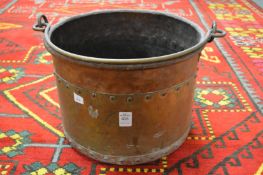A copper coal bucket.