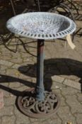 A metal bird bath.