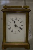 A brass carriage clock.